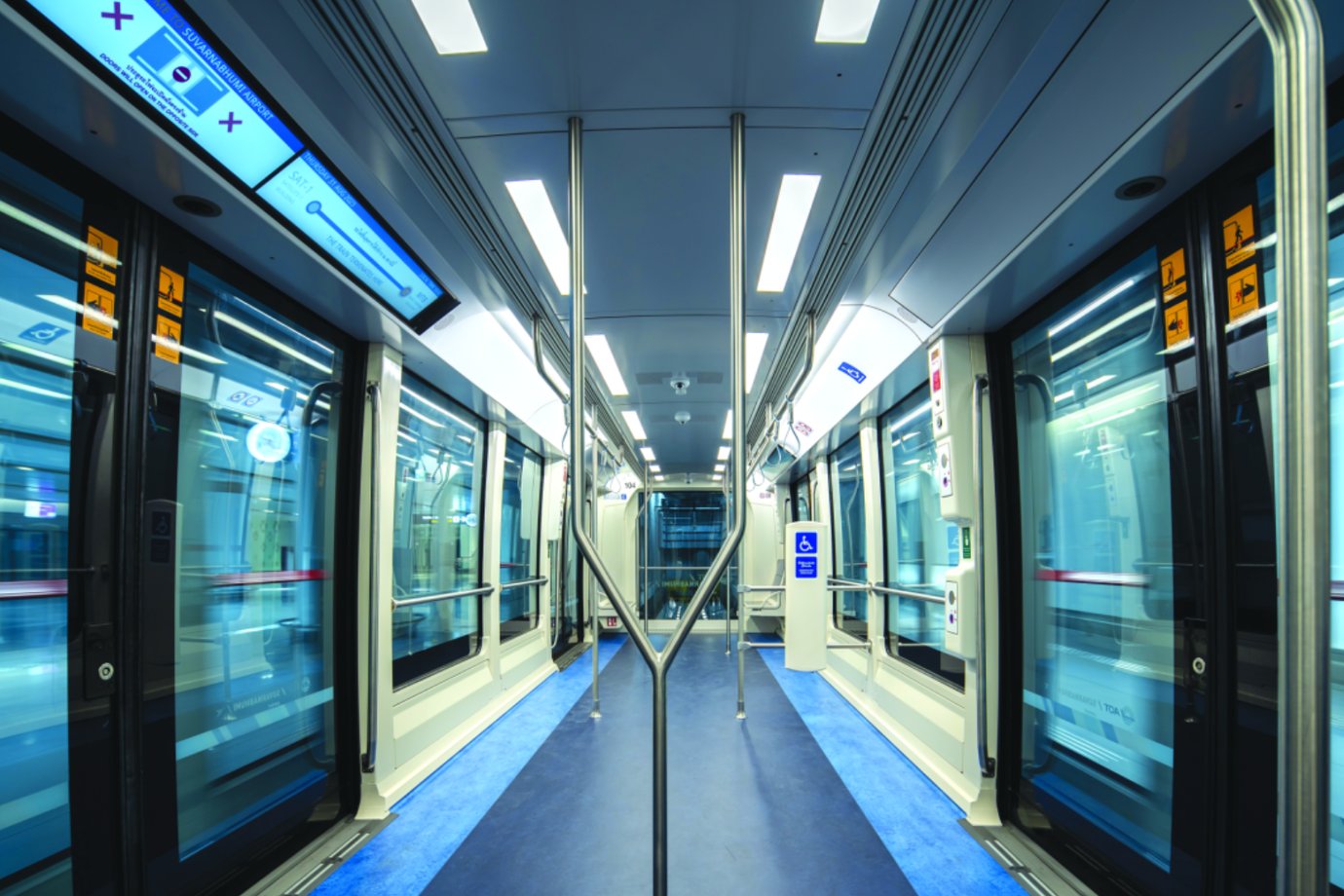 Suvarnabhumi Airport automated train interior with bright lighting and modern seating, used to transport passengers between terminals.