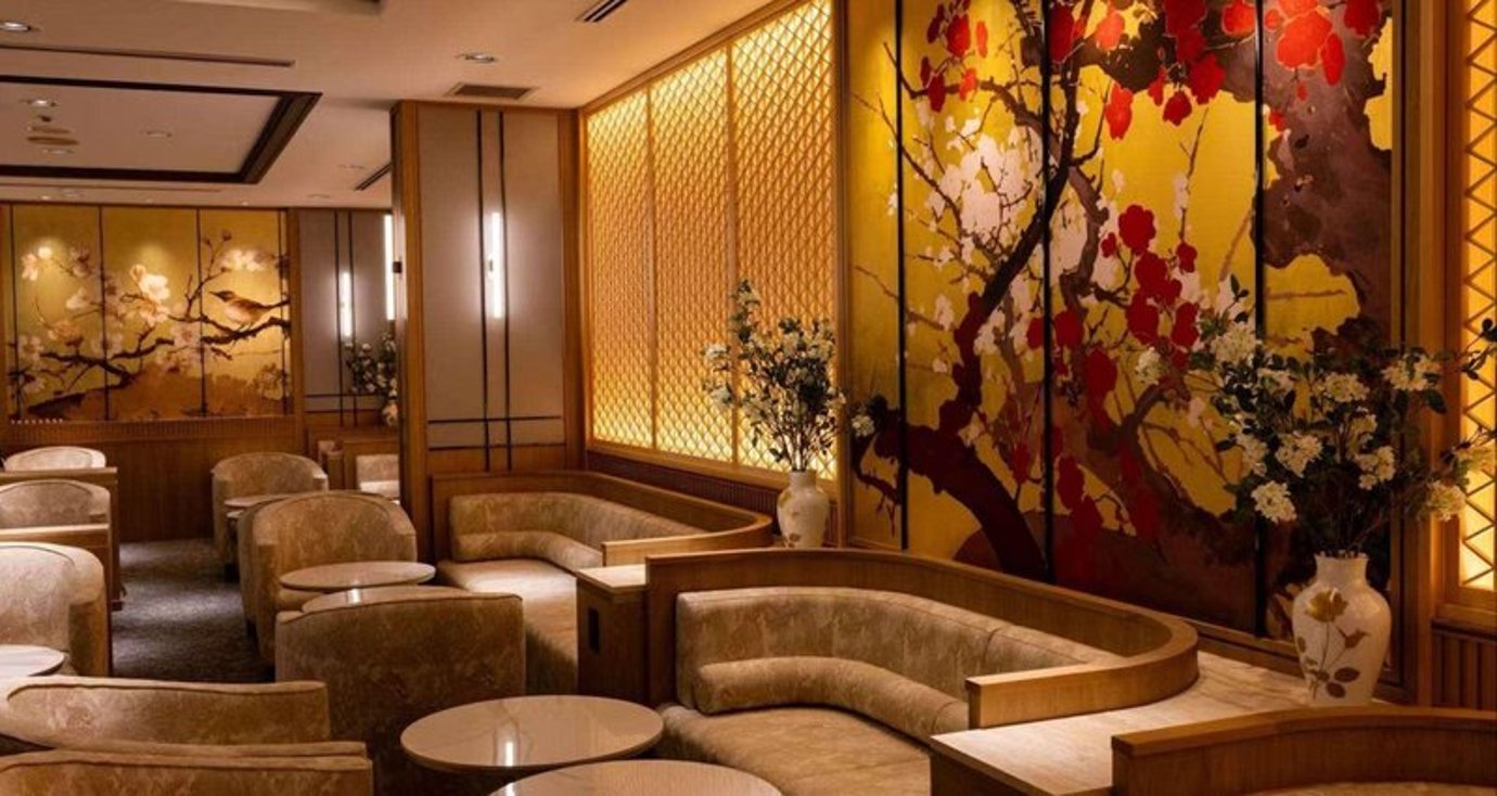 Semi-private seating areas in the Coral Executive Lounge at Chubu Centrair Airport feature curved couches and decorative wall panels. Semi-private seating areas in the Coral Executive Lounge at Chubu Centrair Airport feature curved couches and decorative wall panels.