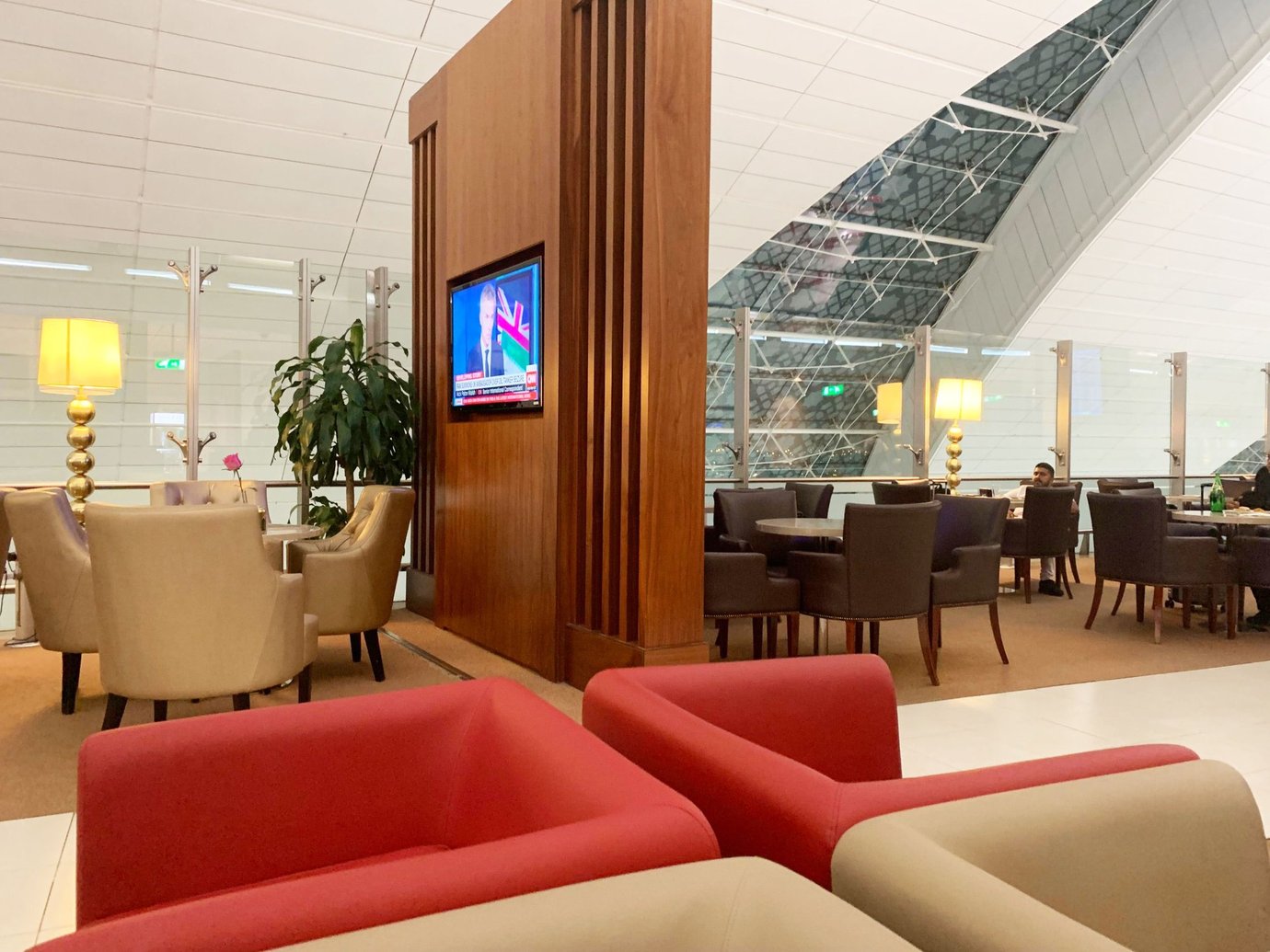 Seating area inside the Marhaba Lounge at Dubai International Airport Terminal 3 Concourse A, featuring comfortable leather armchairs, warm lighting, and views of the terminal’s glass architecture. Seating area inside the Marhaba Lounge at Dubai International Airport Terminal 3 Concourse A, featuring comfortable leather armchairs, warm lighting, and views of the terminal’s glass architecture.