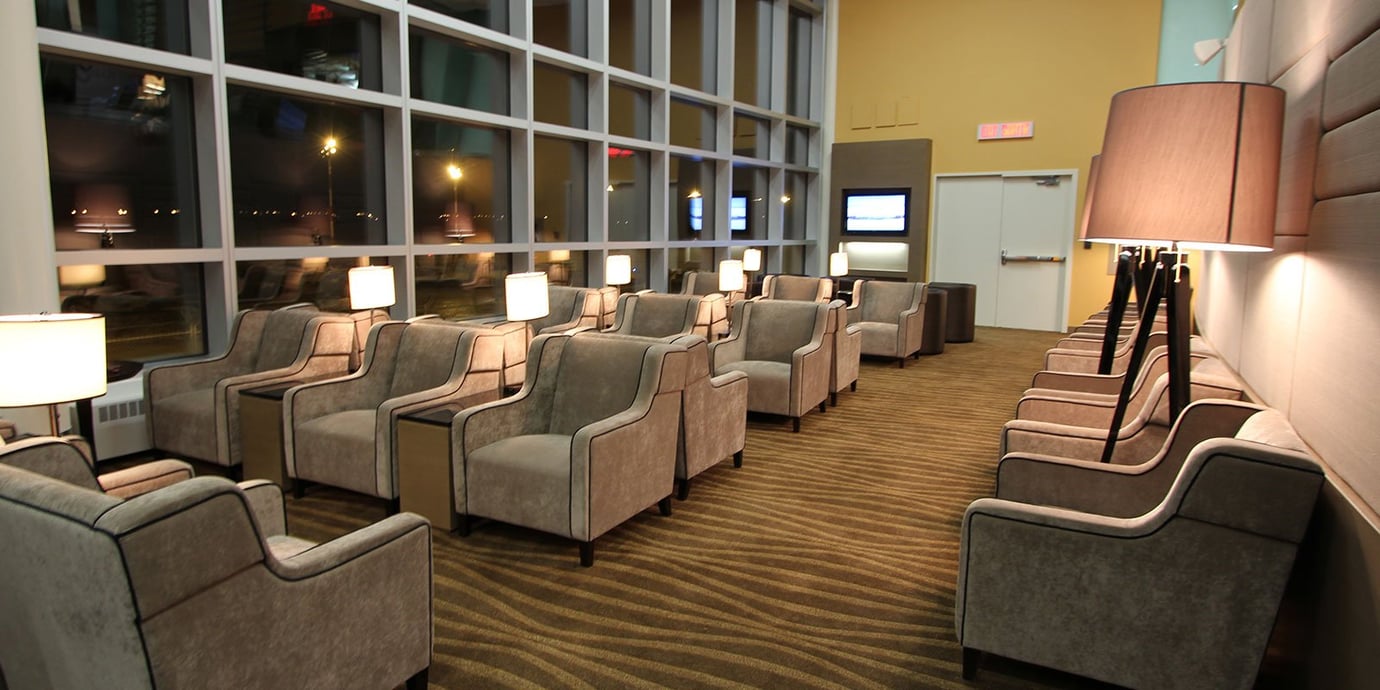 Cozy evening ambiance with plush seating by the large windows in the Plaza Premium Lounge at Edmonton Airport. Cozy evening ambiance with plush seating by the large windows in the Plaza Premium Lounge at Edmonton Airport.