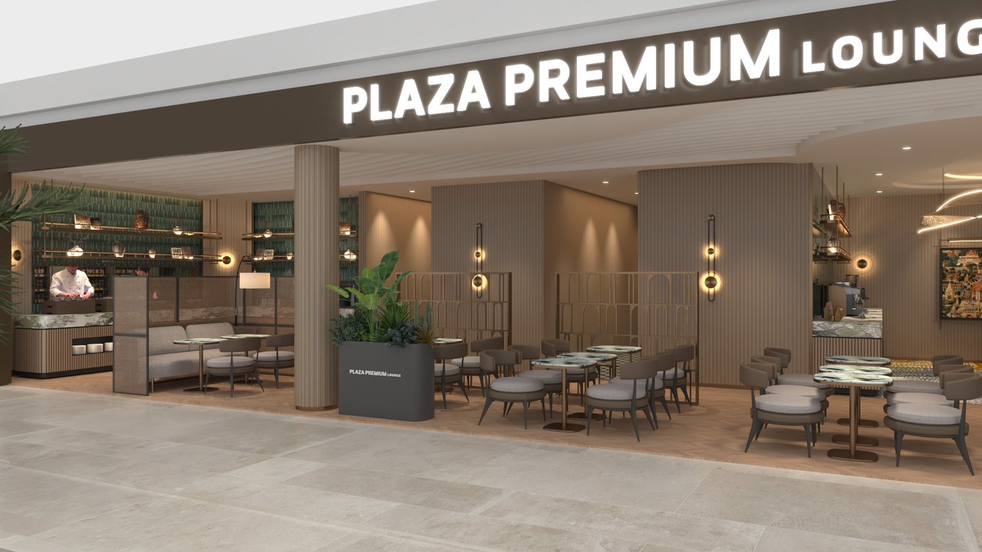 The Plaza Premium Lounge entrance at Techo International Airport features a seating area with tables and a visible food preparation counter. The Plaza Premium Lounge entrance at Techo International Airport features a seating area with tables and a visible food preparation counter.