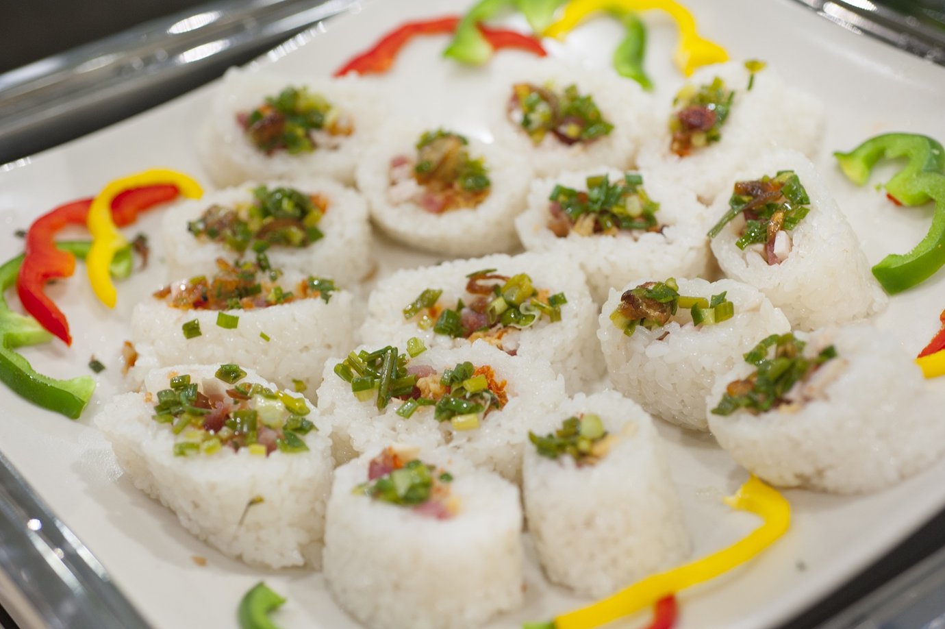 Vietnamese sticky rice bites topped with scallions and savory garnish at Le Saigonnais Lounge buffet. Vietnamese sticky rice bites topped with scallions and savory garnish at Le Saigonnais Lounge buffet.