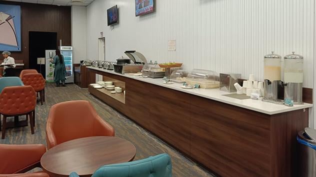 Self-service buffet food area at the AMD The Lounge Terminal 2
