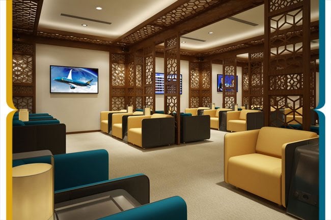 Elegant seating area inside the Vietnam Airlines Lotus Lounge at Da Nang International Airport, featuring modern armchairs, partitioned wooden lattice panels, and flat-screen TVs.