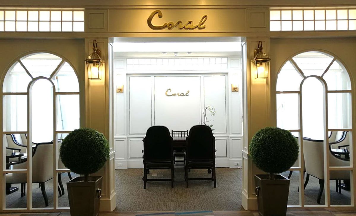 Entryway of The Coral Executive Lounge Sino Lounge at Phuket Airport with elegant design and seating.