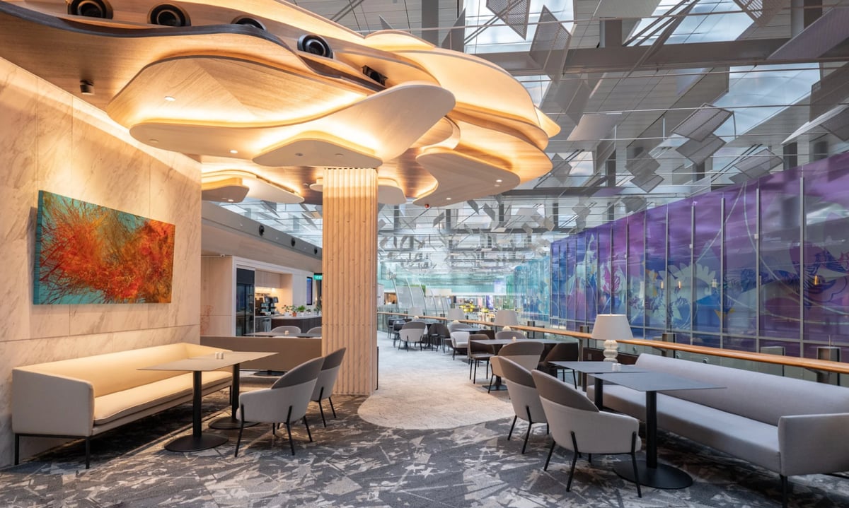 DBS Private Access Lounge at Singapore Changi Airport, featuring modern seating, artistic ceiling design, and elegant interiors with natural light.”