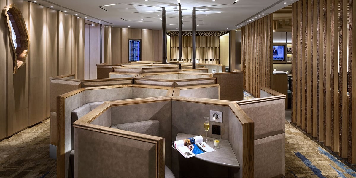 Private seating cubicles in Plaza Premium Lounge at Taipei Taoyuan Airport, offering intimate space for travelers.