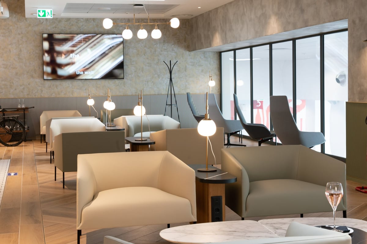 Seating and natural lighting streaming into lounge space at Milan HelloSky Lounge
