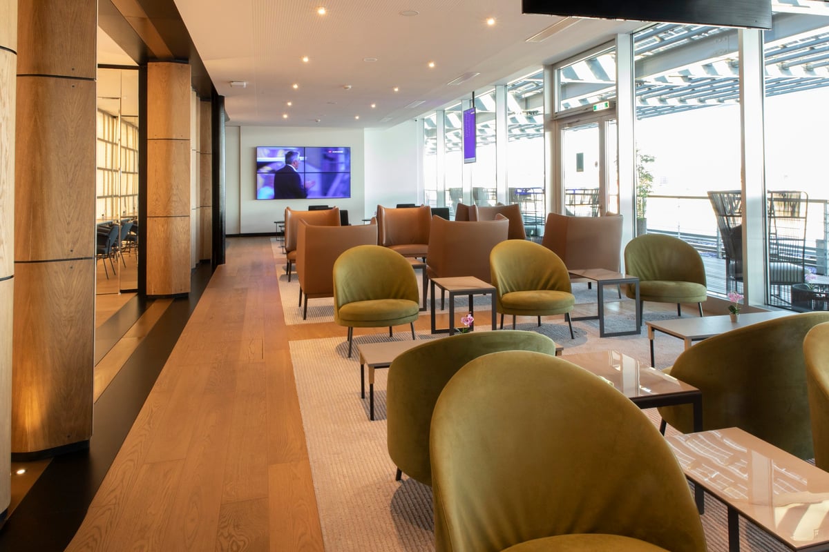 Bed with welcome card at HelloSky Air Rooms at HelloSky Airport Lounge Fiumicino