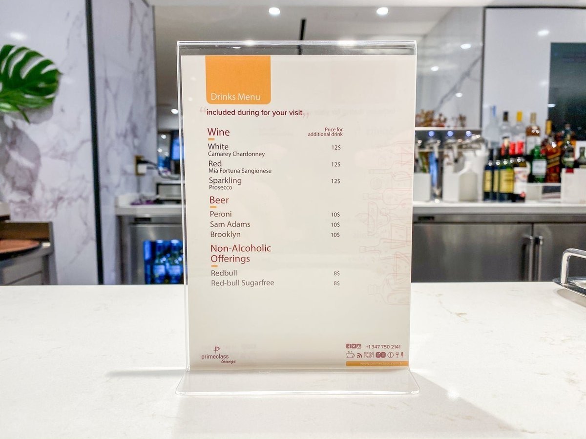 Drinks menu including wine, beer and non-alcoholic beverages at the T1 Primeclass Lounge at JFK Airport.