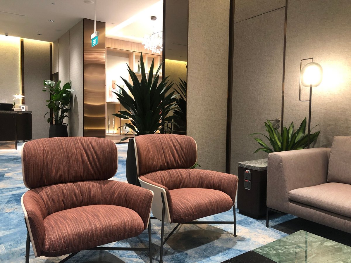 Stylish lounge chairs and sofa seating with modern decor at Changi Lounge, Jewel Changi Airport Singapore.