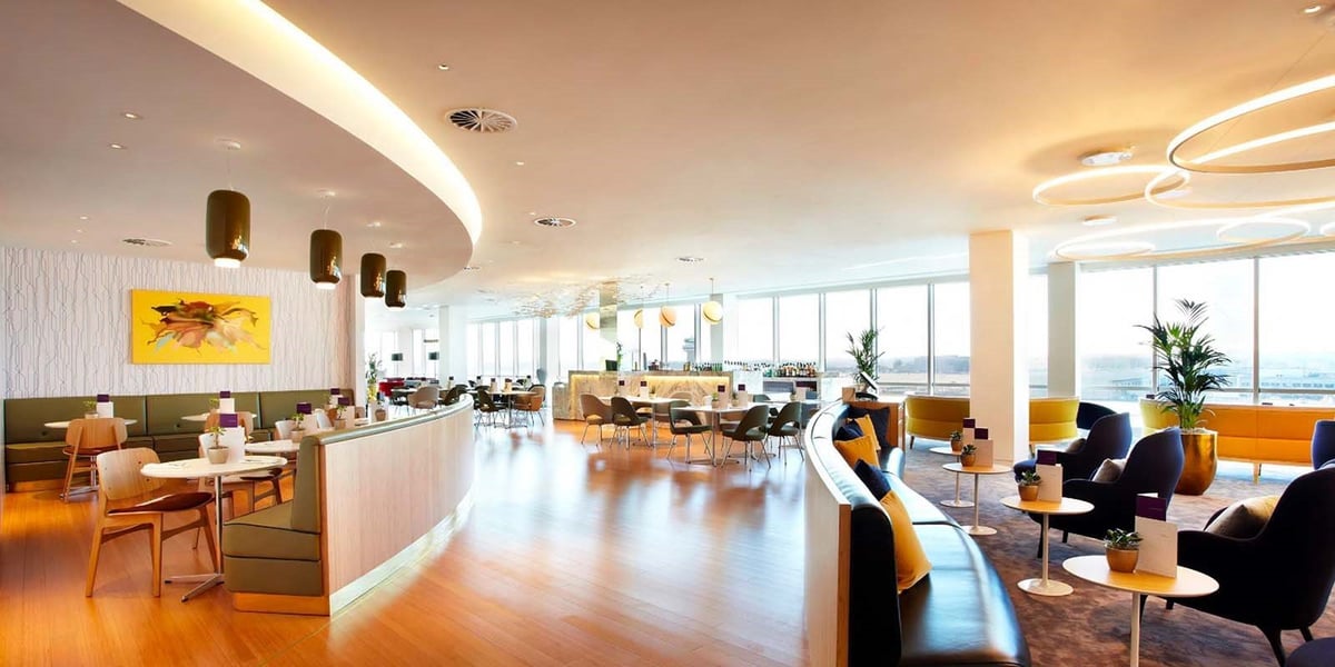 Plaza Premium Lounge Gatwick Seating and Dining Areas with Large Windows Overlooking the Apron