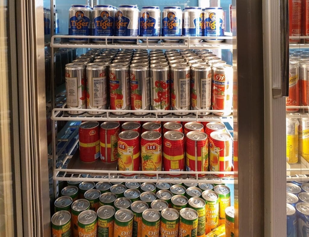 Assortment of canned soft drinks and beer in the fridge at SATS Premier Lounge, Singapore Changi Airport Terminal 3.