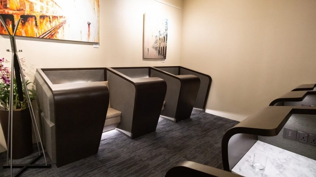 Private seating pods with modern design inside SATS Premier Lounge at Singapore Changi Airport Terminal 3, offering a quiet workspace for travelers.
