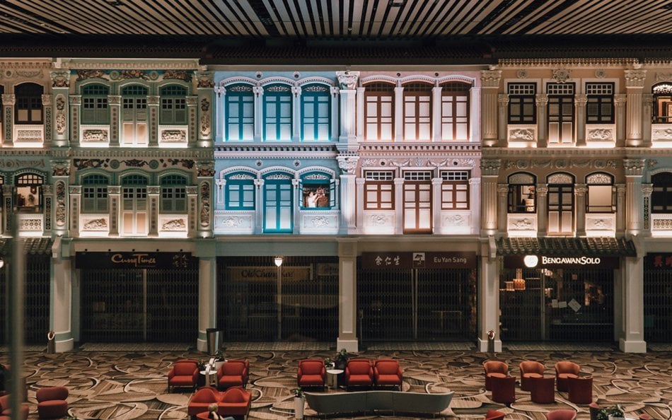 Peranakan-style heritage zone at Singapore Changi Airport Terminal 4, showcasing colorful shophouse façades with local shops and cultural design.