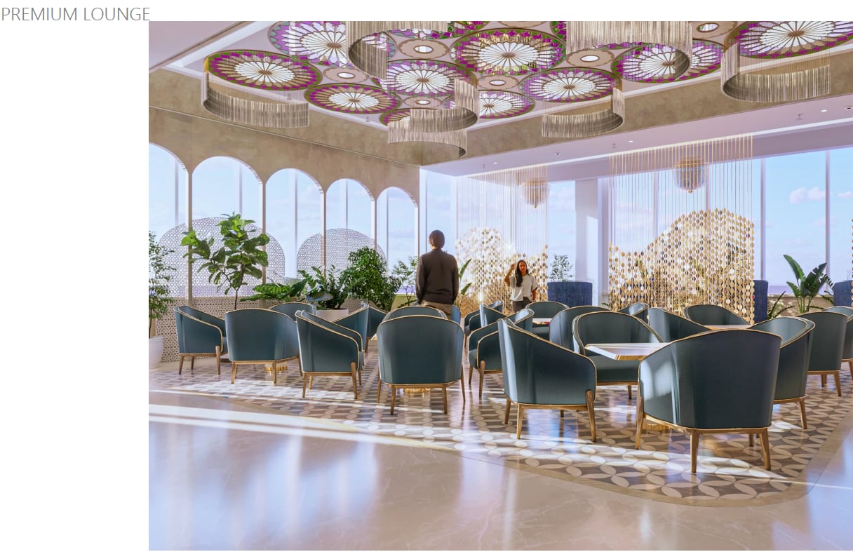Premium Lounge at Ahmedabad Airport T1 featuring teal armchairs, patterned flooring, large arched windows, indoor plants, and decorative ceiling lights.