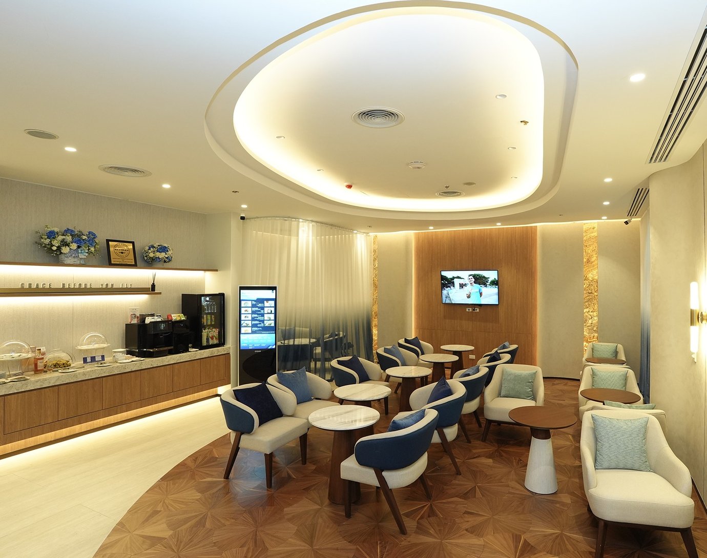 Bangkok Airways Blue Ribbon Lounge at Don Mueang Airport with modern seating and refreshment area.
