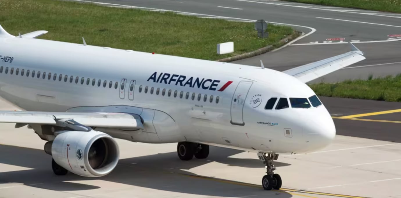 Air France aircraft with signature blue, white, and red livery parked on the tarmac. Air France aircraft with signature blue, white, and red livery parked on the tarmac.