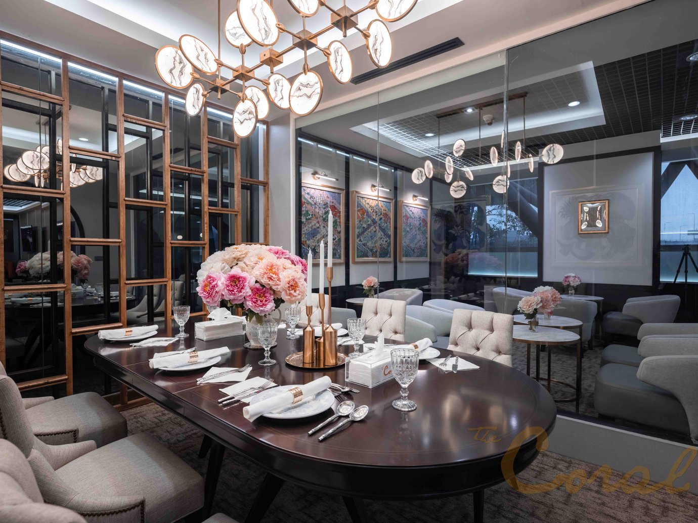 Private dining area at The Coral Finest Business Class Lounge Concourse D Bangkok Suvarnabhumi Airport featuring an elegant table setting, plush seating, floral centrepiece, and modern chandelier lighting. Private dining area at The Coral Finest Business Class Lounge Concourse D Bangkok Suvarnabhumi Airport featuring an elegant table setting, plush seating, floral centrepiece, and modern chandelier lighting.