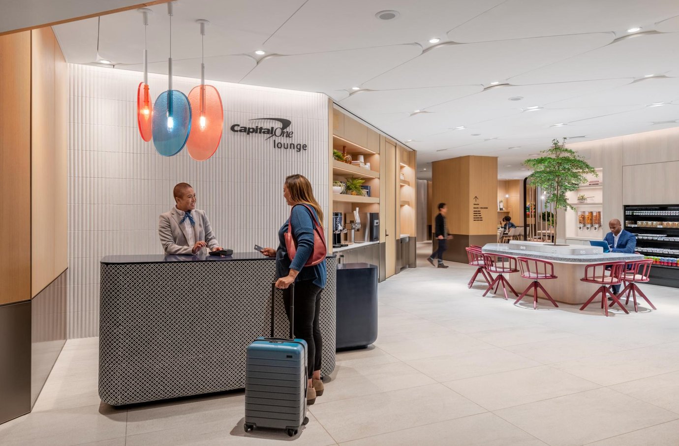 Reception area at Capital One Lounge DFW Airport featuring modern check-in services, contemporary seating, bright open interiors, and premium traveller amenities. Reception area at Capital One Lounge DFW Airport featuring modern check-in services, contemporary seating, bright open interiors, and premium traveller amenities.