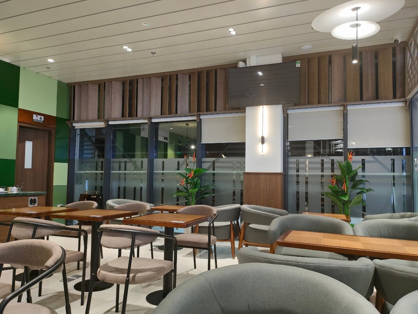 Điện Biên Business Lounge seating area at Điện Biên Phủ Airport (DIN), Vietnam, with modern armchairs, dining tables, and premium airport lounge facilities.