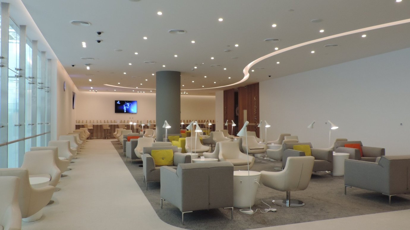Modern seating area inside the SkyTeam Lounge at Dubai International Airport Terminal 1, featuring sleek armchairs, bright lighting, and contemporary design elements for premium travelers. Modern seating area inside the SkyTeam Lounge at Dubai International Airport Terminal 1, featuring sleek armchairs, bright lighting, and contemporary design elements for premium travelers.