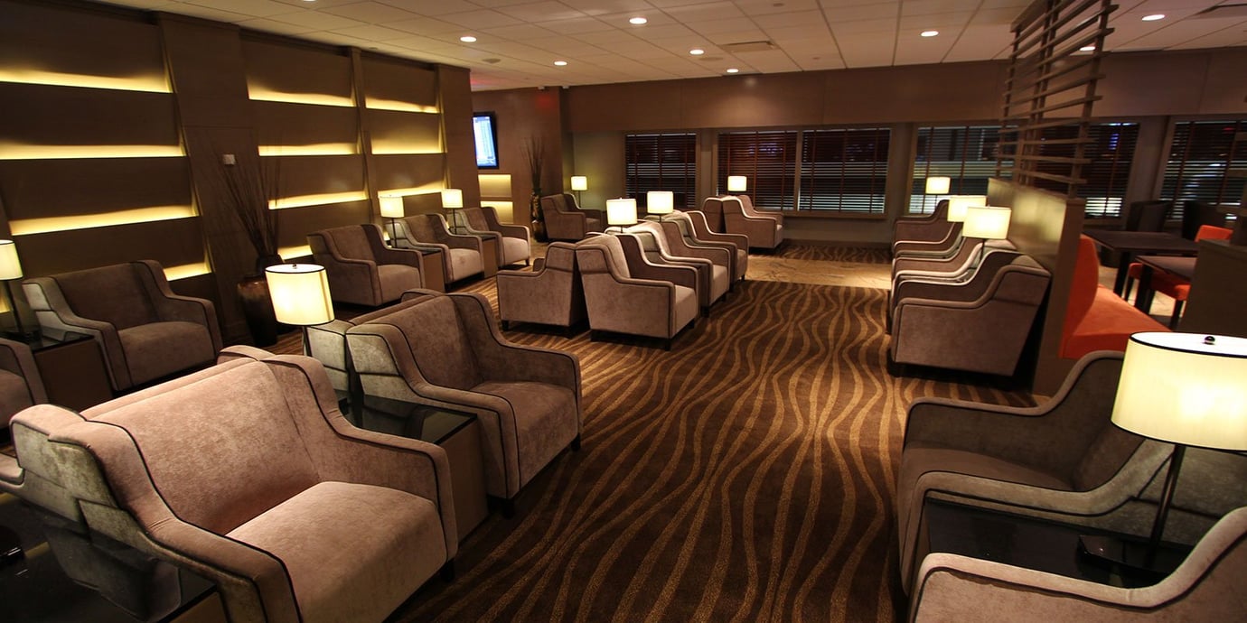 Plaza Premium Lounge (Non-US Departures) Edmonton Airport - seating options with artificial lighting
