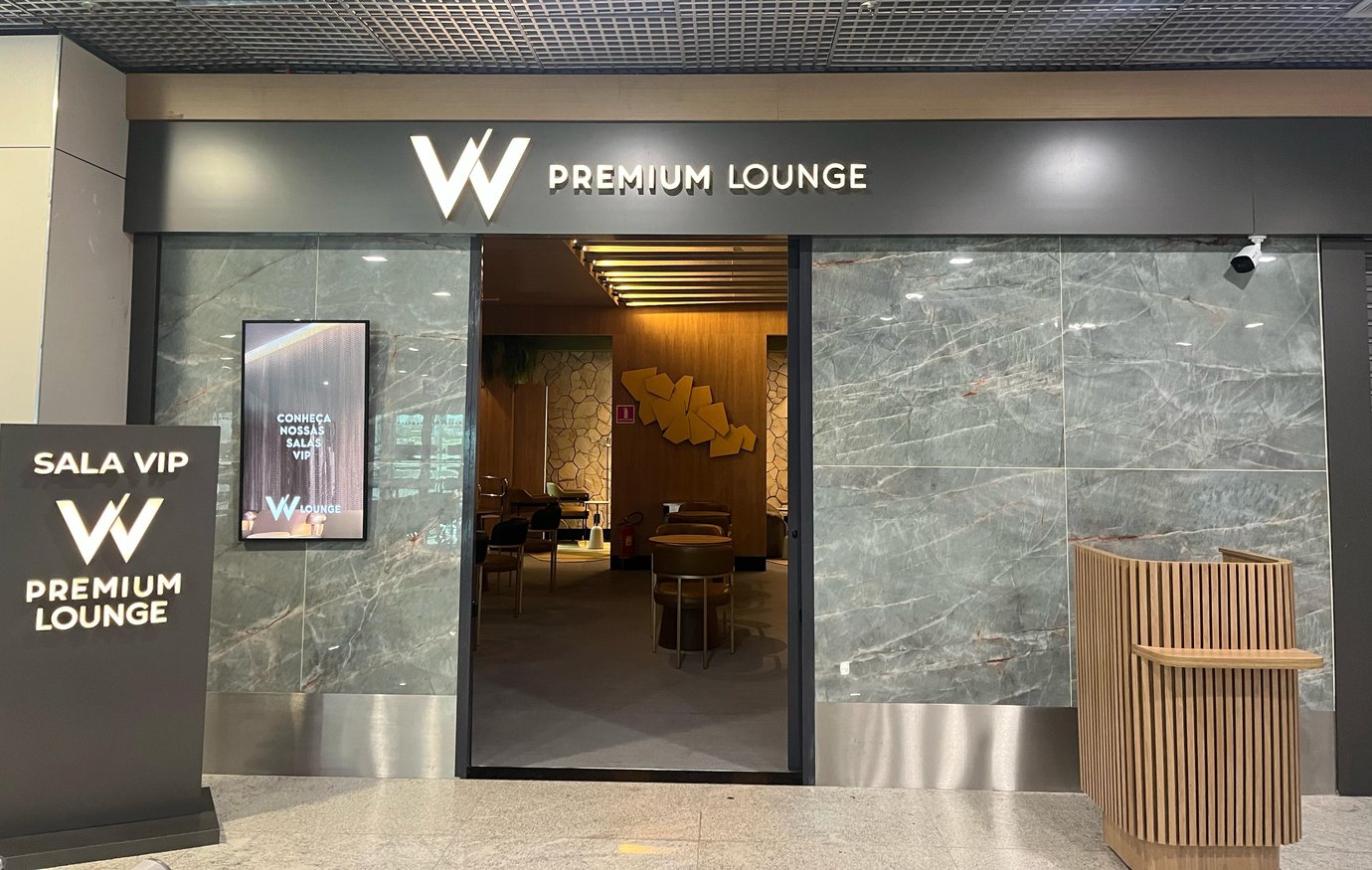 The entrance to the W Premium Lounge at Fortaleza International Airport features a reception area and visible seating inside. The entrance to the W Premium Lounge at Fortaleza International Airport features a reception area and visible seating inside.