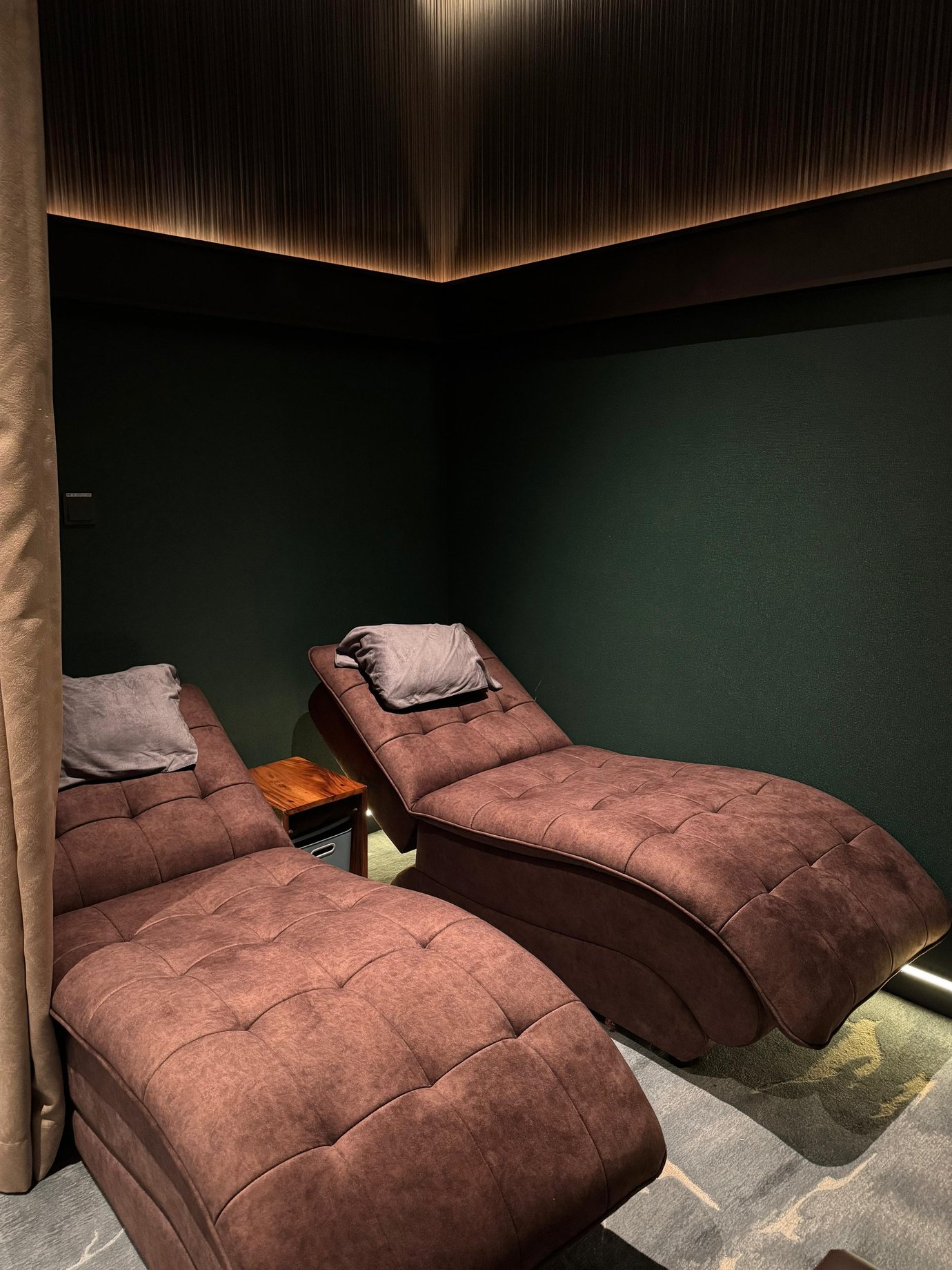 The massage area at Plaza Premium First Lounge, Techo International Airport, features reclining chairs with pillows for passenger comfort.