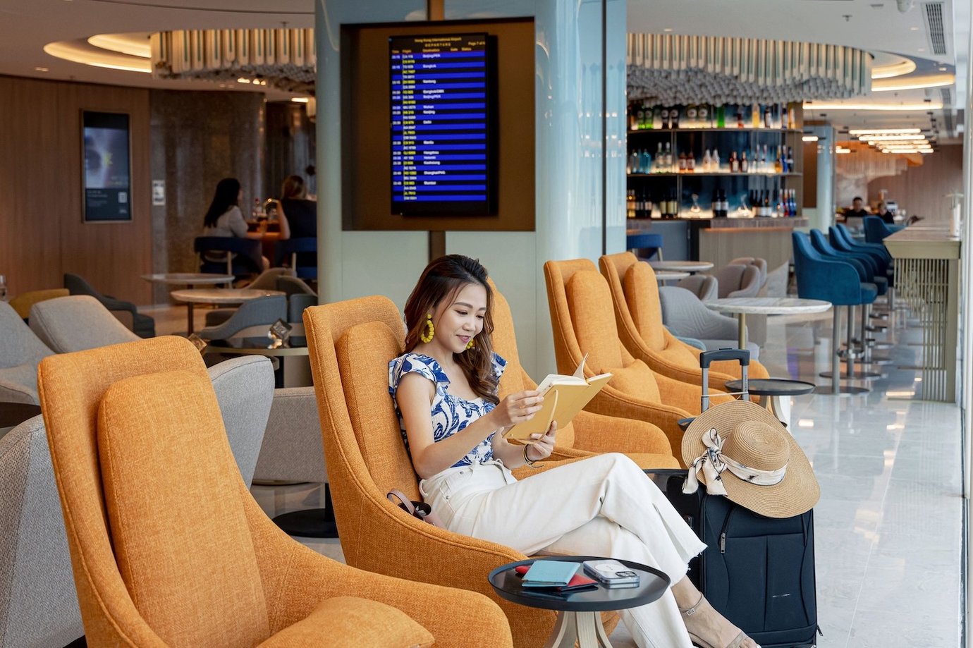 Woman in the Kyra Lounge at Hong Kong International Airport (HKG)