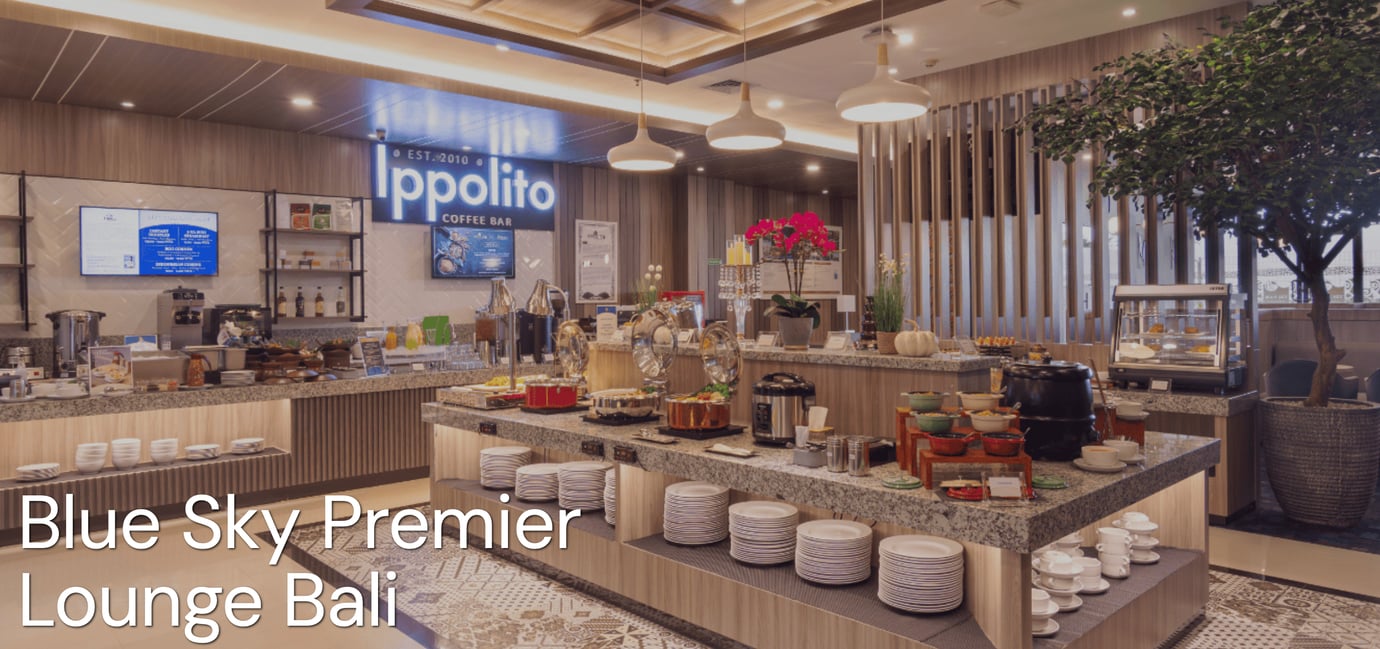 Blue Sky Premier Lounge Bali buffet at Ngurah Rai International Airport (DPS), featuring hot food stations, Indonesian dishes, self-service counters and Ippolito Coffee Bar.