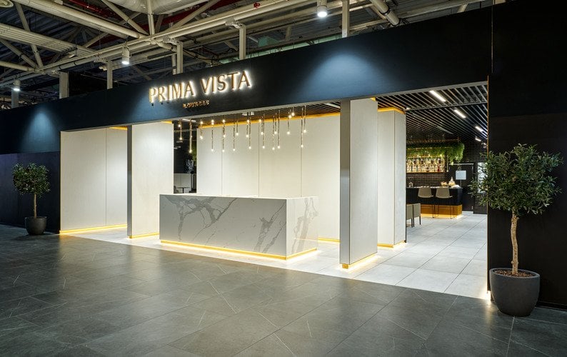 The Prima Vista Lounge entrance at Leonardo da Vinci-Fiumicino Airport features a reception area with adjacent seating and bar visible inside. The Prima Vista Lounge entrance at Leonardo da Vinci-Fiumicino Airport features a reception area with adjacent seating and bar visible inside.